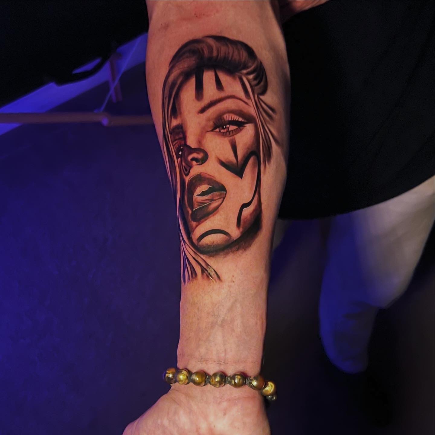 Geometric Portrait tattoo by Cam Donachie