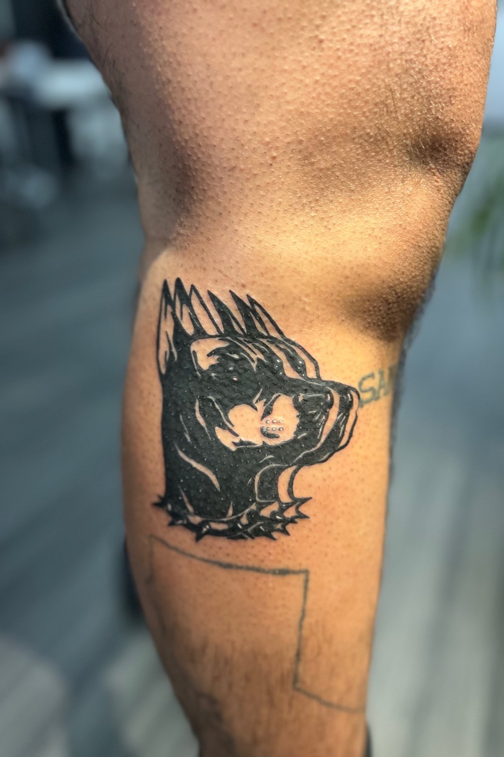 Doberman tattoo by Cam Donachie